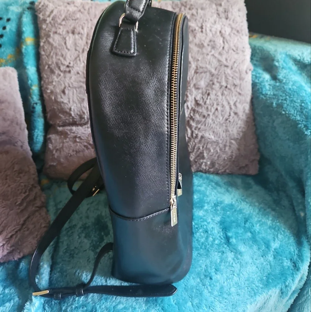 AS-IS Kate Spade black leather backpack LEFT STRAP AT THE TOP TORN. STILL NEW